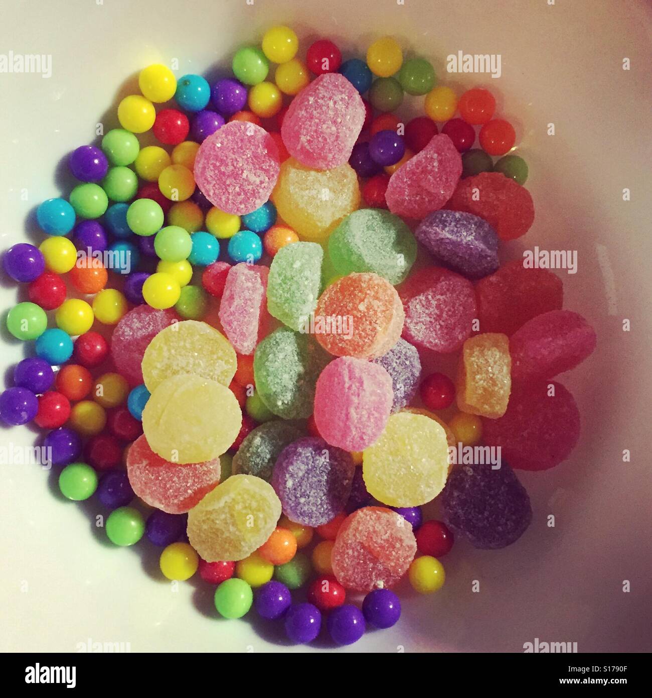 Gummies and sweeties in a bowl by K.R. Stock Photo