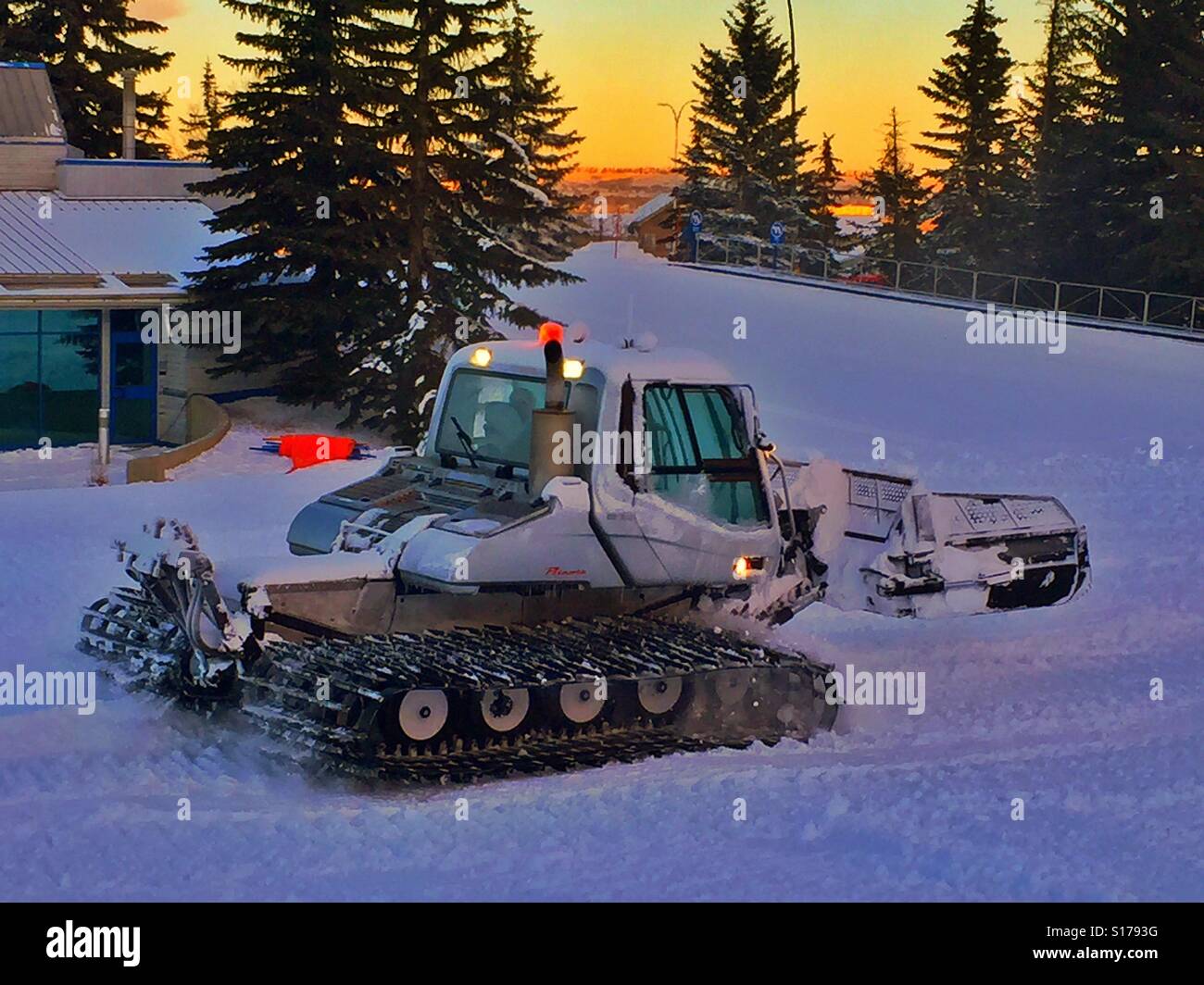 Grooming the ski hill Stock Photo