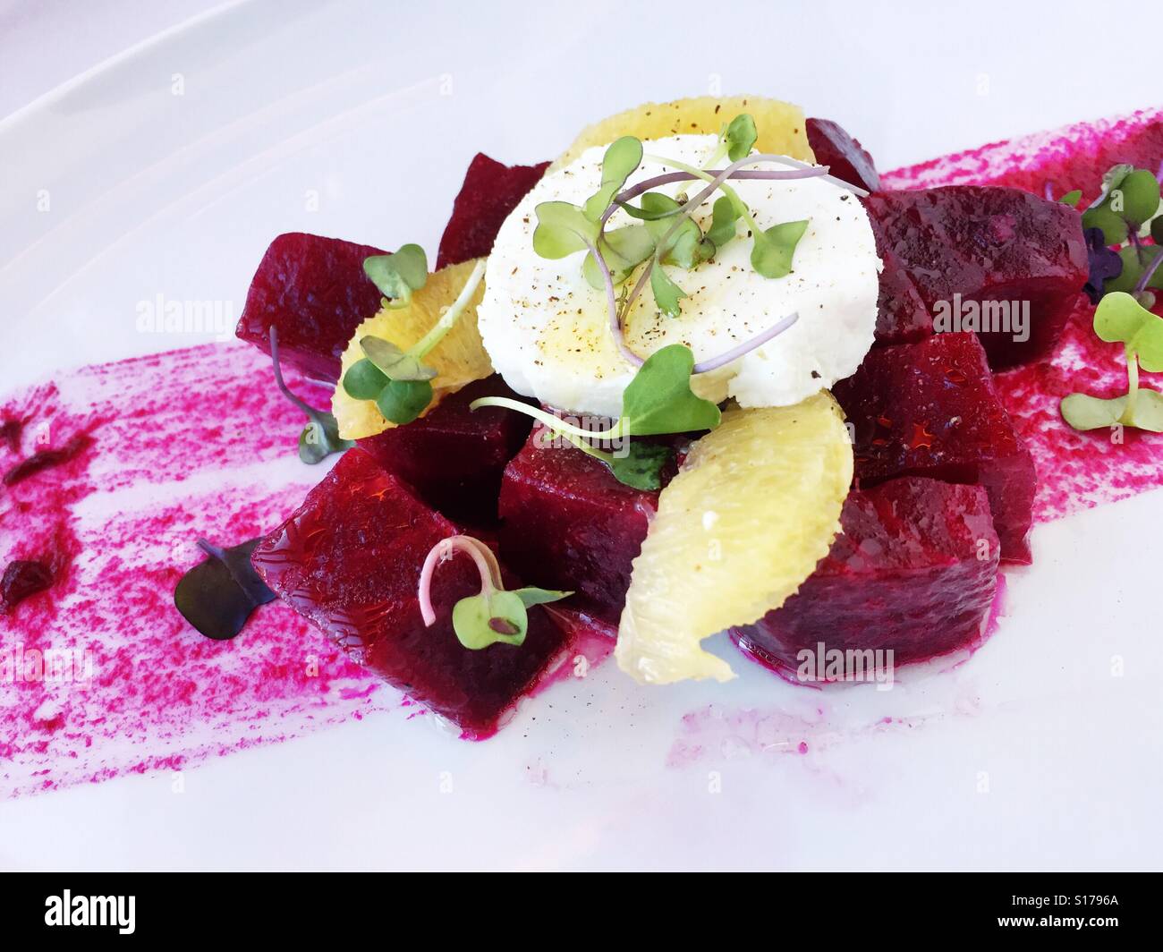Fresh organic beets and cheese salad at upscale luxury NYC restaurant - Smartphone Captured Stock Image