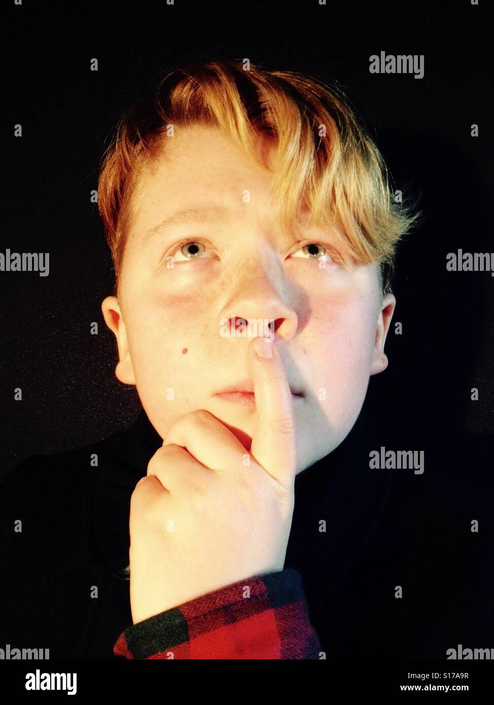 12-year old boy thinking Stock Photo