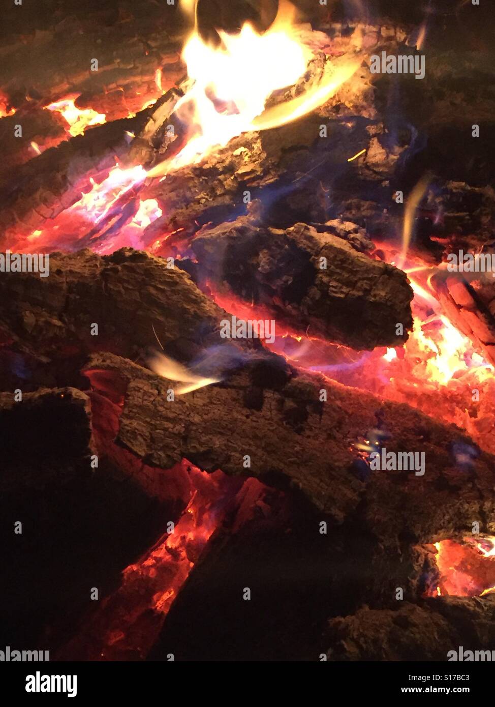 Red hot fire on logs - Smartphone Captured Stock Image