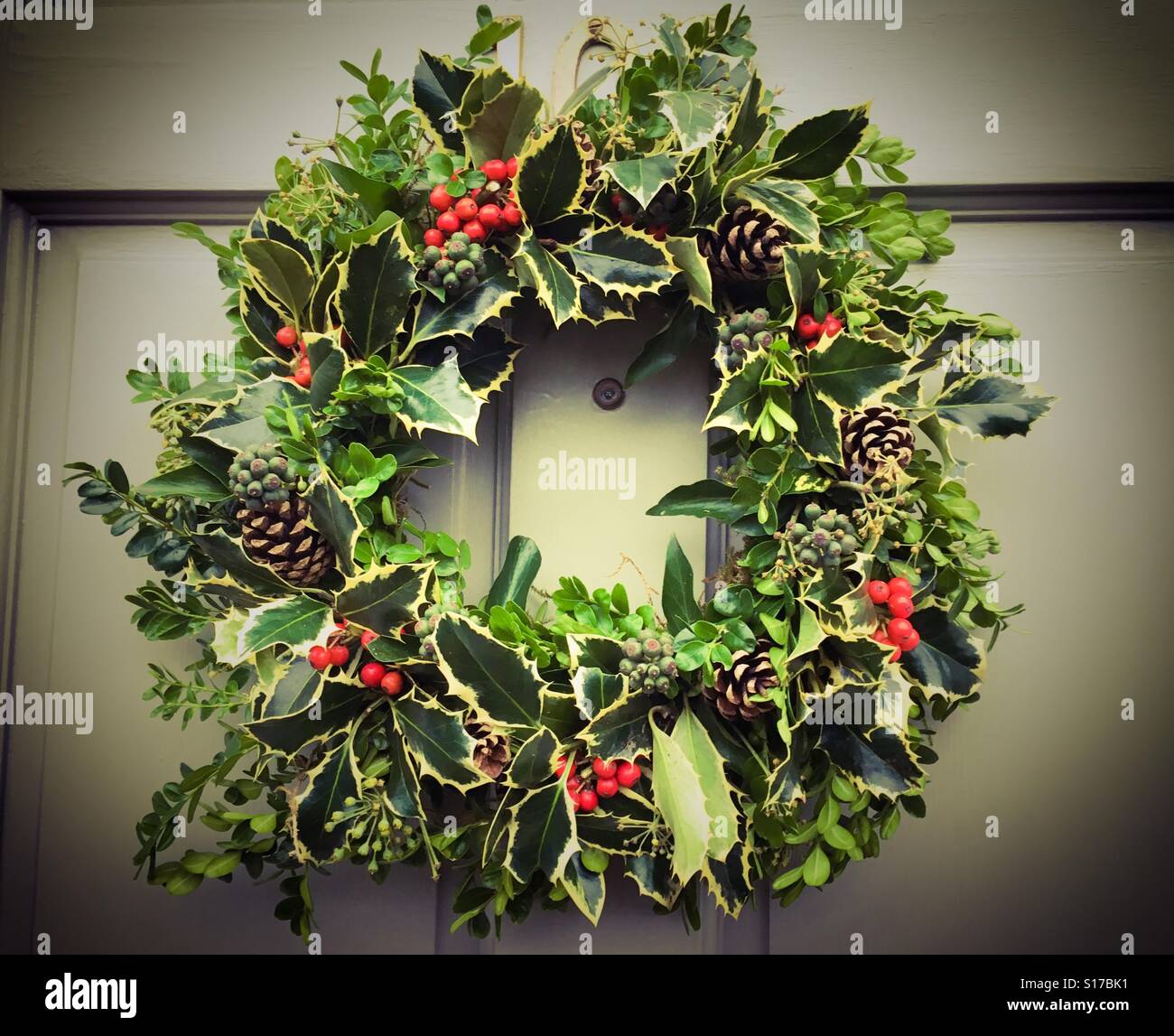 A Christmas reef hanging on a door Stock Photo Alamy
