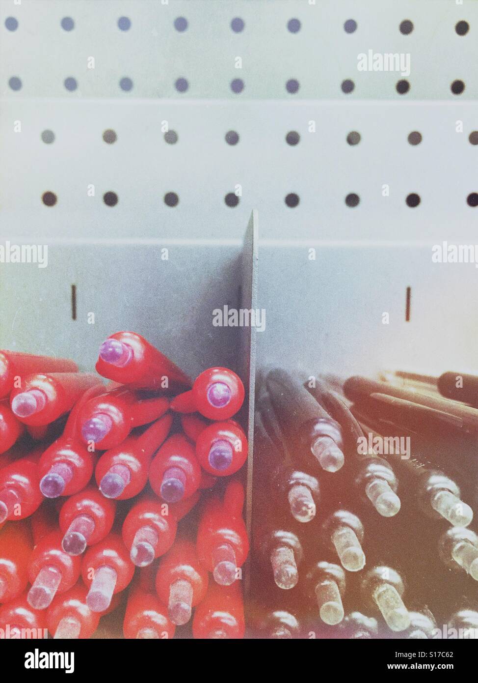 Red and black ballpoints in shop display - Smartphone Captured Stock Image