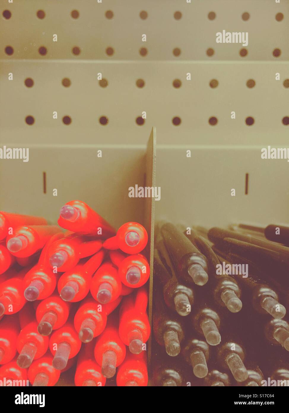 Red and black ballpoints in shop display - Smartphone Captured Stock Image