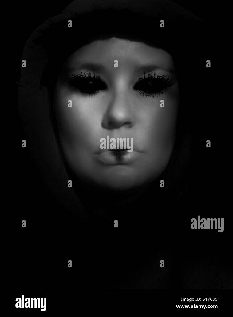 Dark portrait of woman with black eyes Stock Photo Alamy