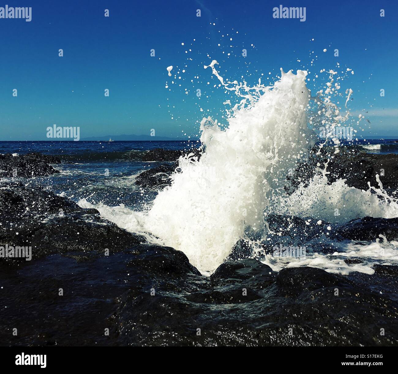 Wave crashing against rocks, Pacific ocean Gauancaste Costa Rica - Smartphone Captured Stock Image