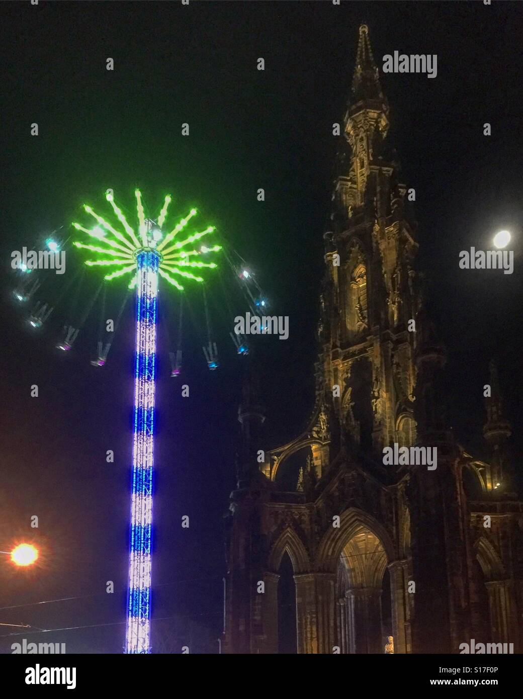 Edinburgh Christmas The Scott Monument in Princes Street and the Star Flyer part of the