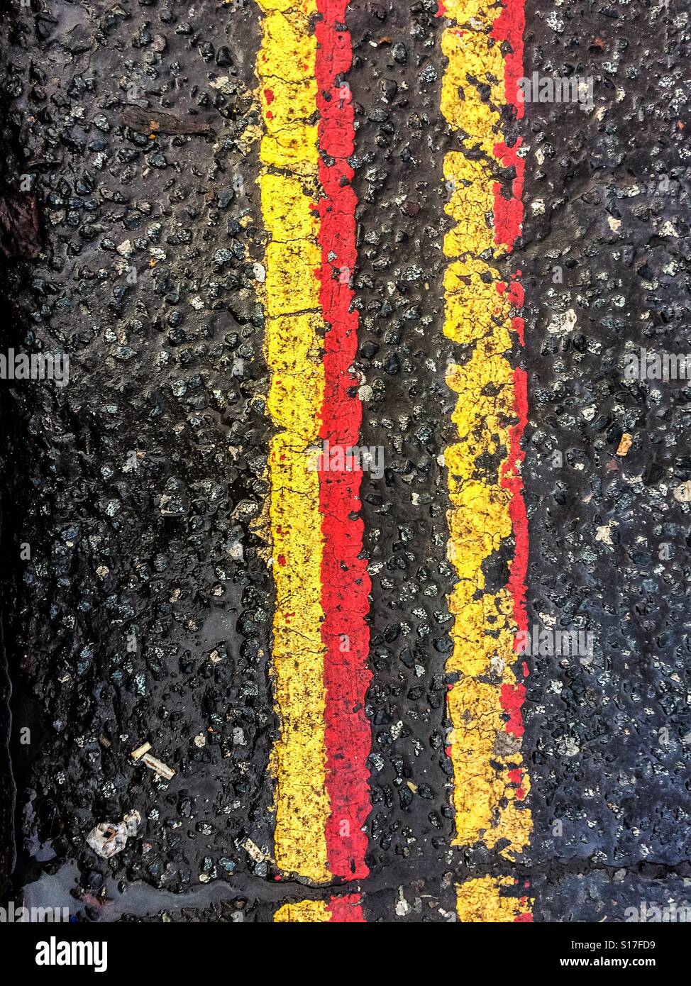 Yellow and red lines on the road - Smartphone Captured Stock Image