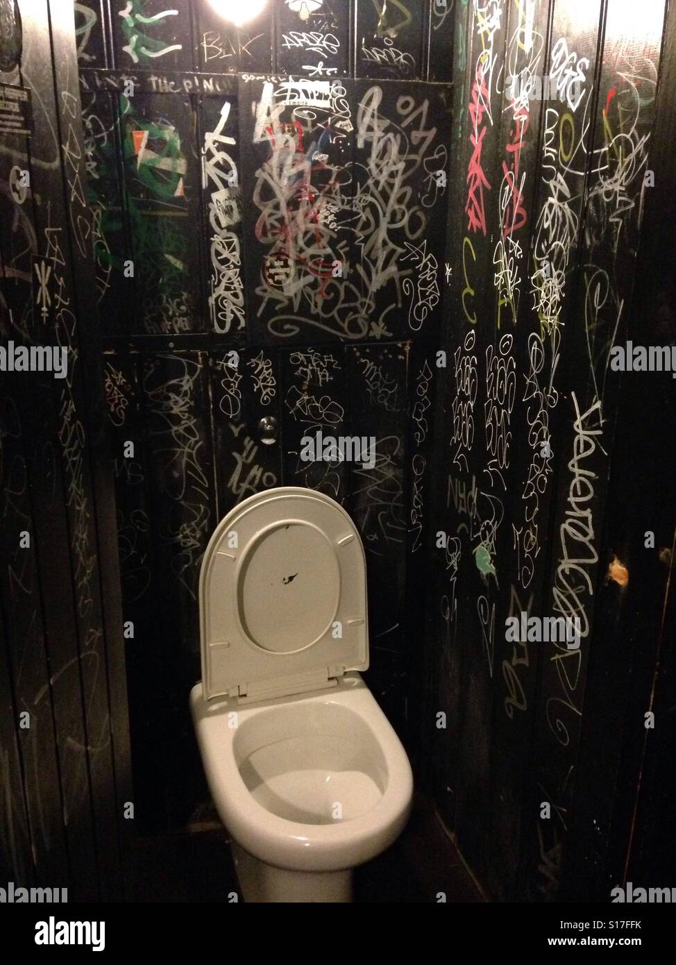 https://c8.alamy.com/comp/S17FFK/graffiti-covered-walls-in-a-dark-and-dingy-mens-room-S17FFK.jpg
