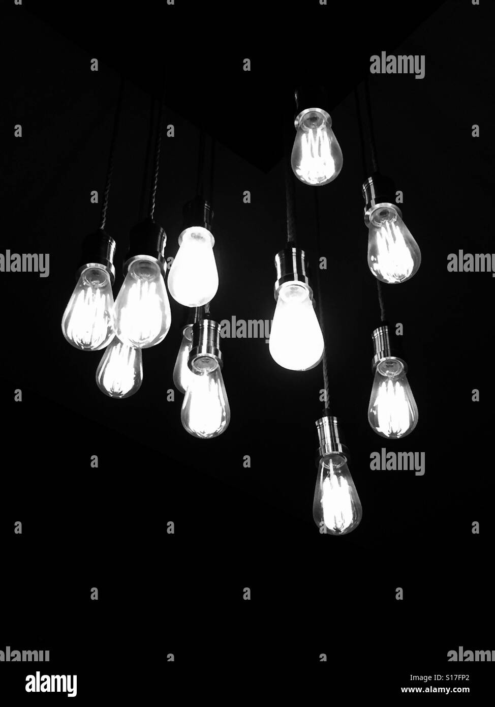 Modern lightbulb fittings hanging down from ceiling Stock Photo Alamy