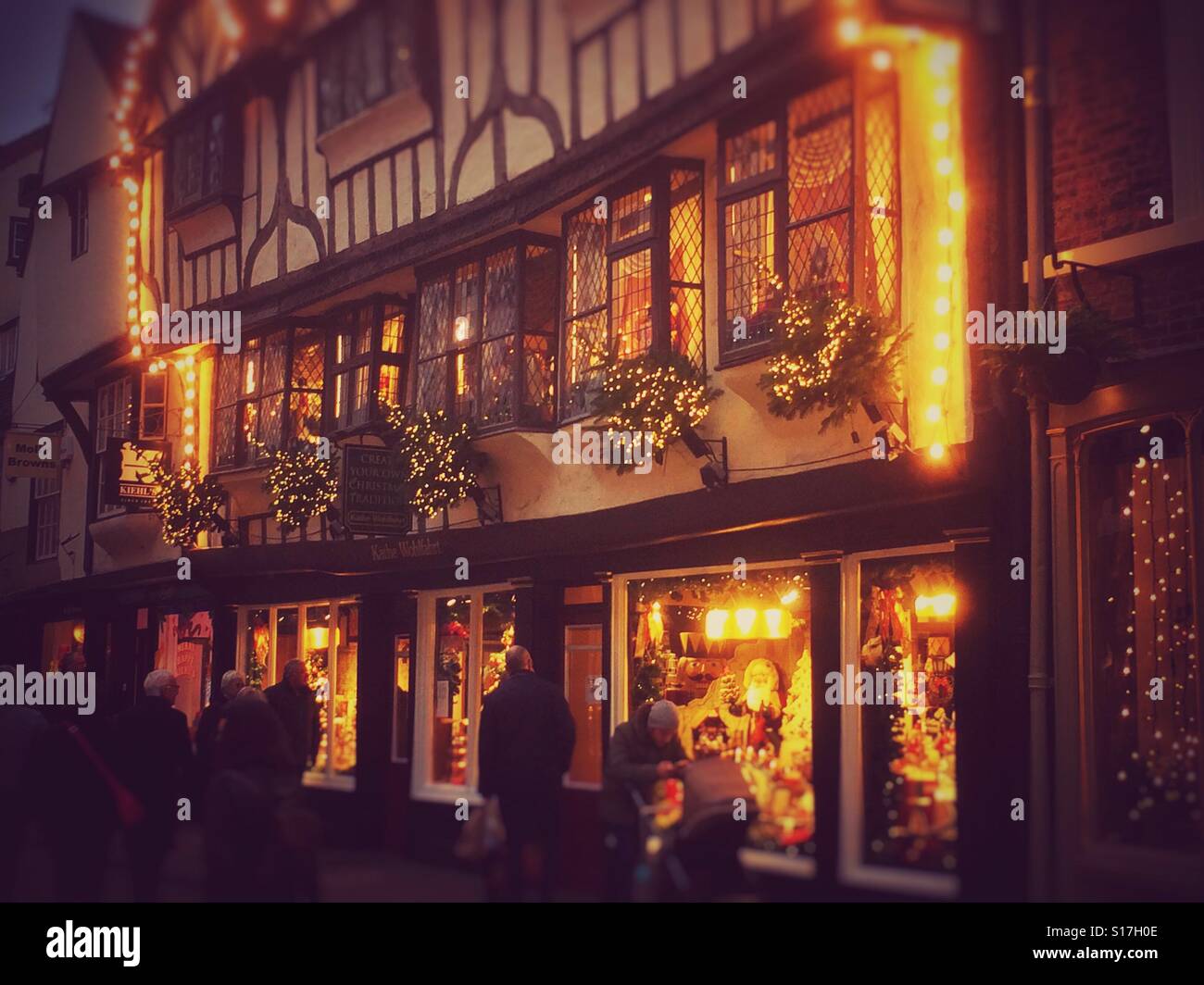Shops decorated for Christmas Stonegate York North Yorkshire England UK - Smartphone Captured Stock Image