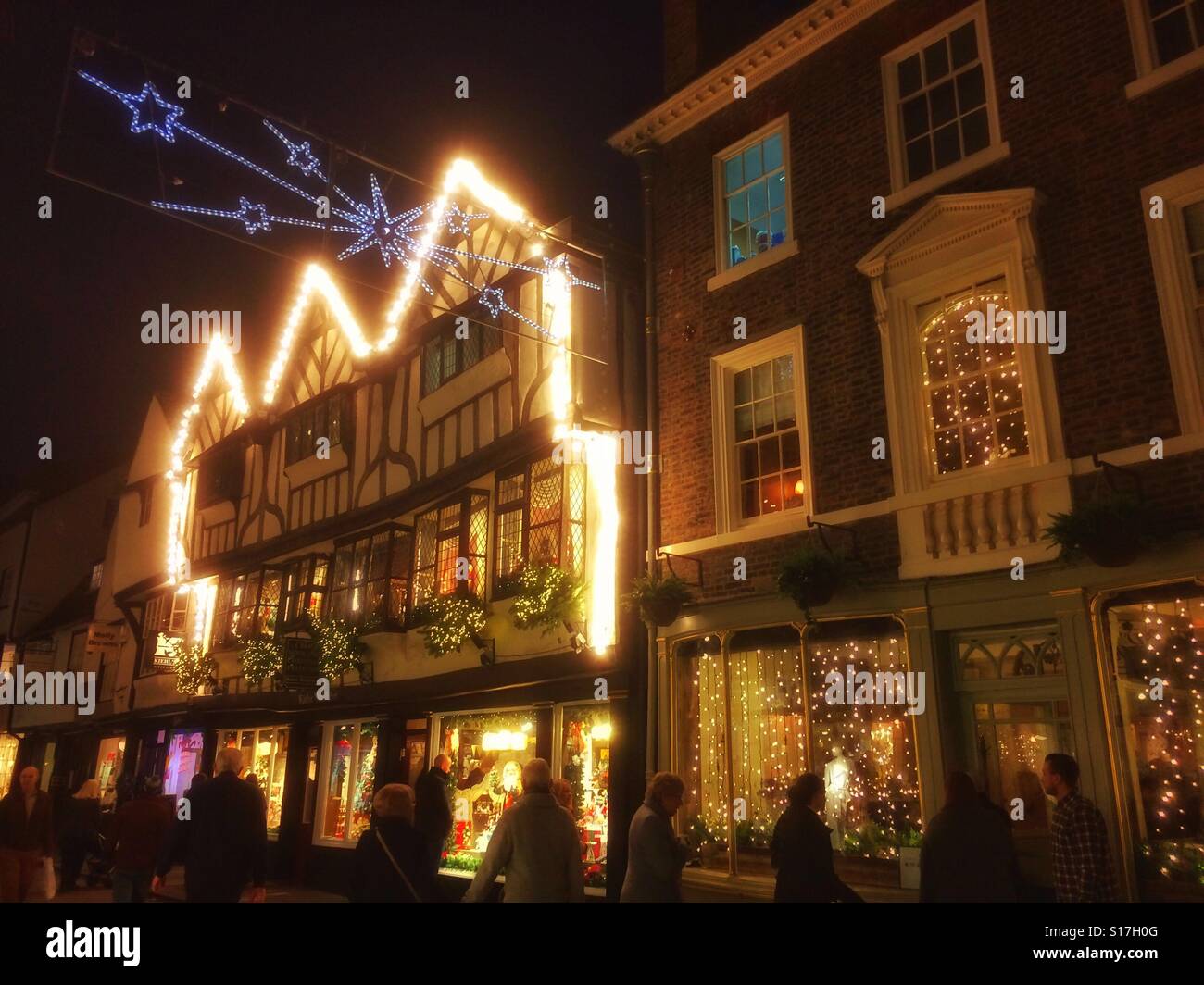Shops decorated for Christmas Stonegate York North Yorkshire England UK - Smartphone Captured Stock Image