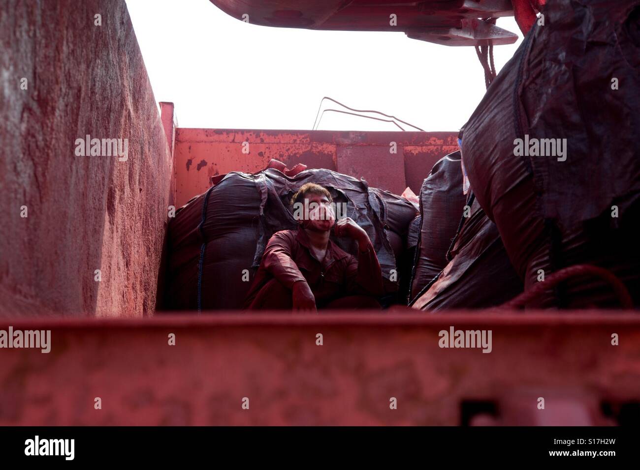 Here is amir one worker of red earth mineral he got tired and take break a little for doing his job again. Stock Photo
