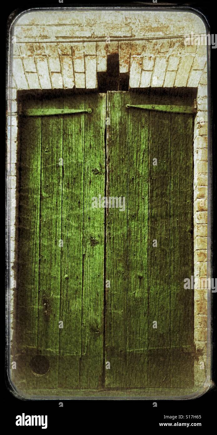 Old green shutters using grunge film Stock Photo