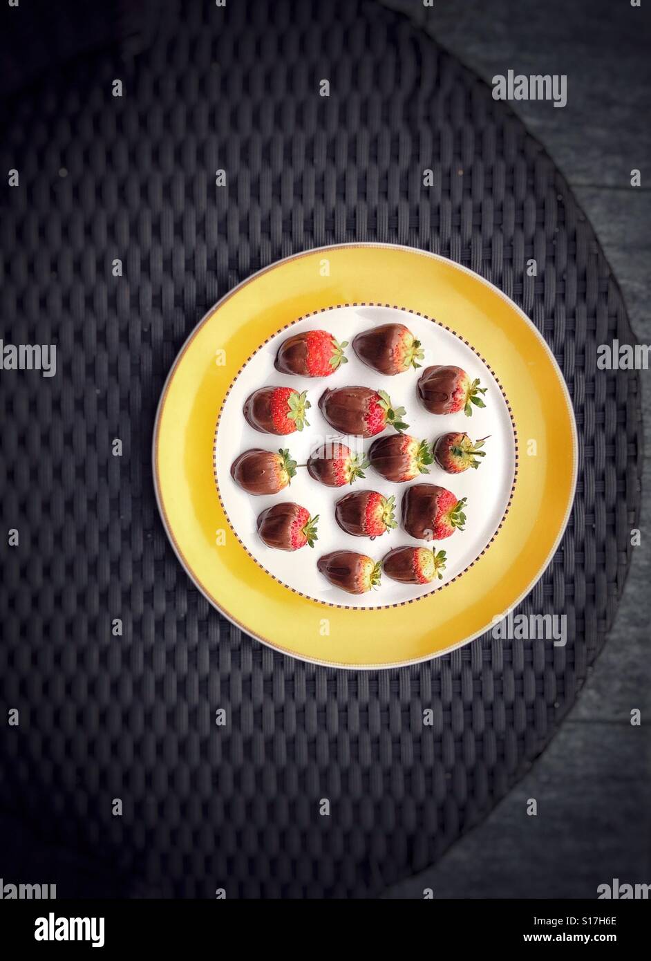Plate with strawberries in chocolate Stock Photo - Alamy