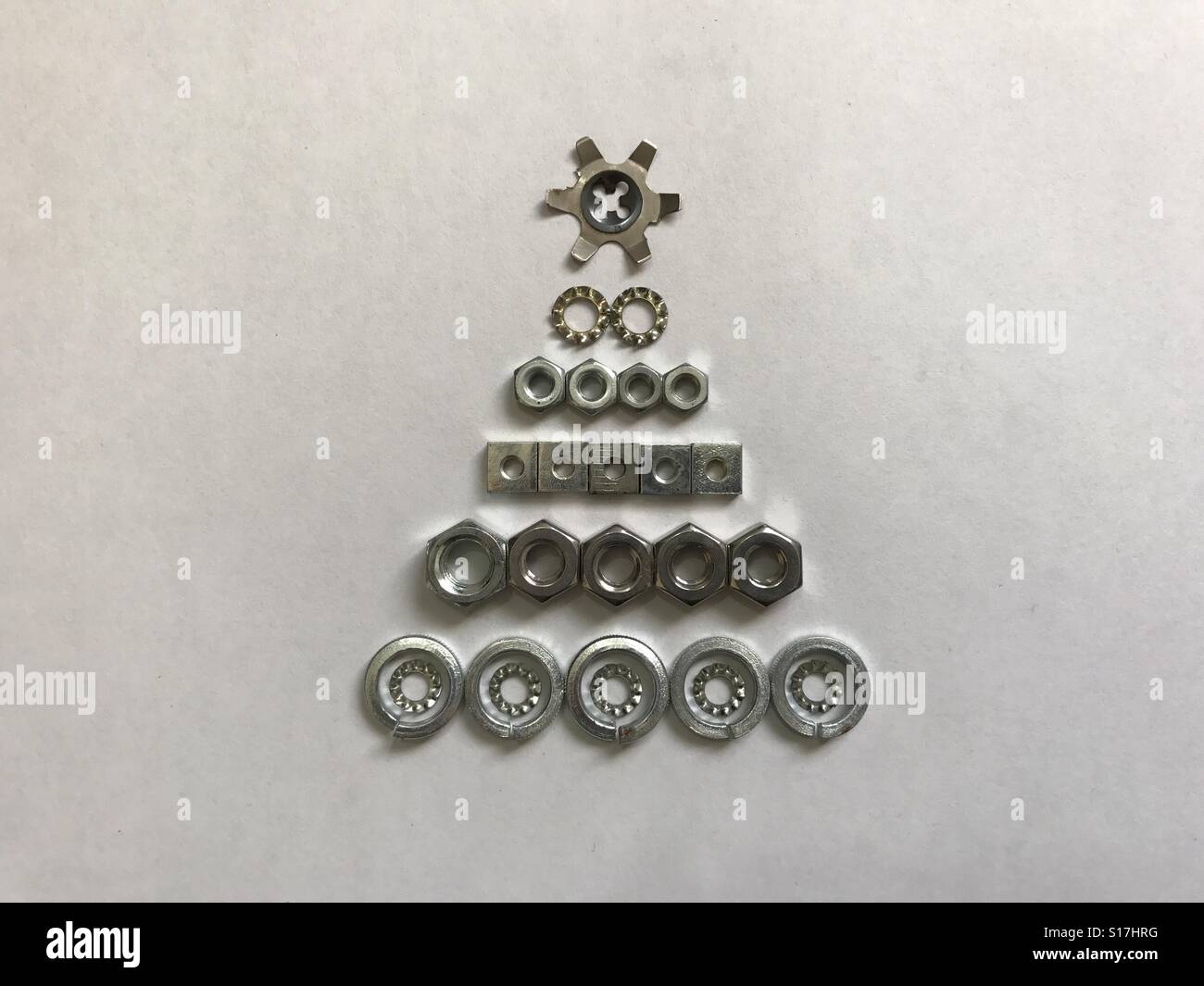 Christmas tree made of nuts and washers Stock Photo