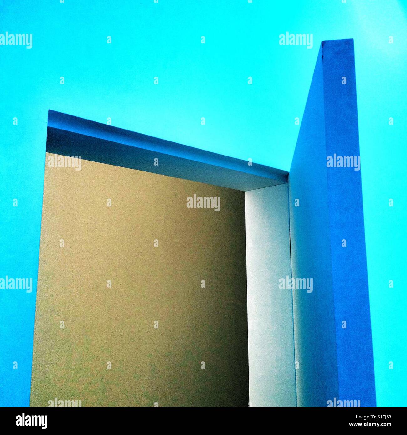 An open door in a blue room - Smartphone Captured Stock Image