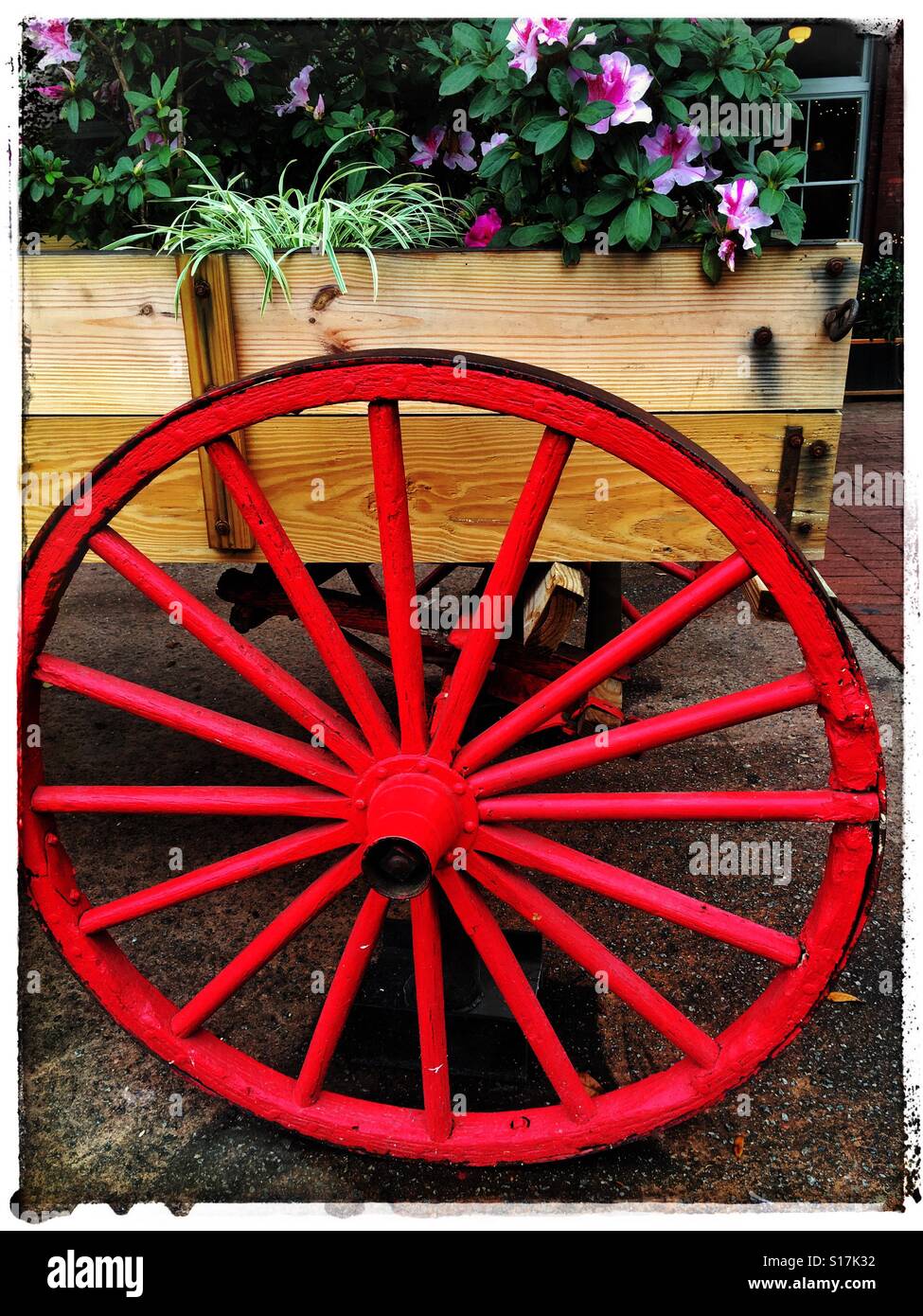 Wagon wheel on flower cart Stock Photo Alamy