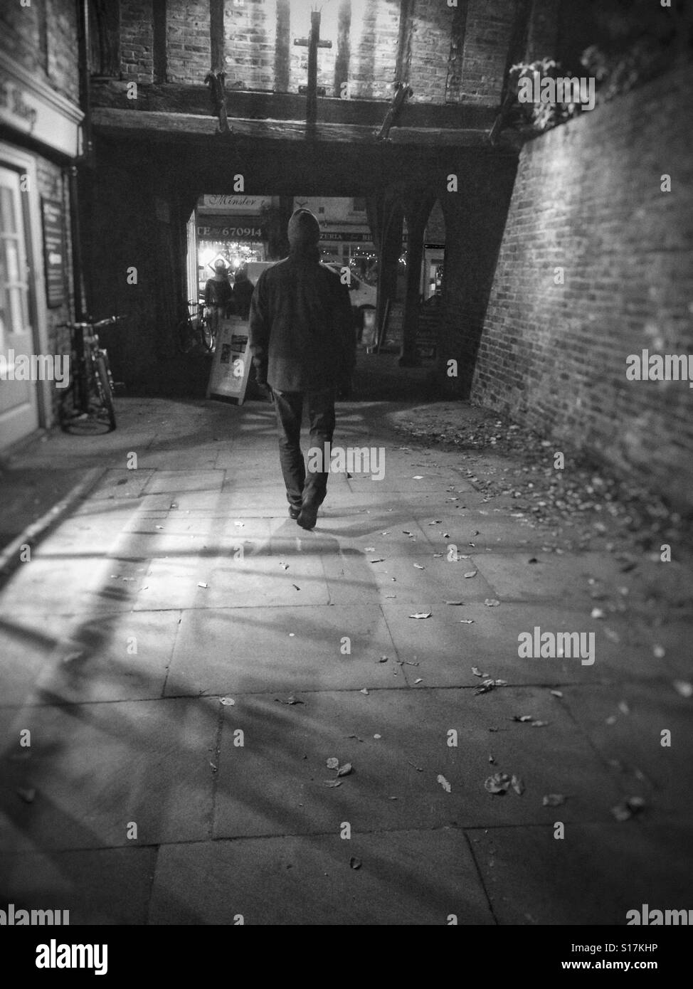 Man walking along footpath at night England UK United Kingdom GB Great Britain - Smartphone Captured Stock Image