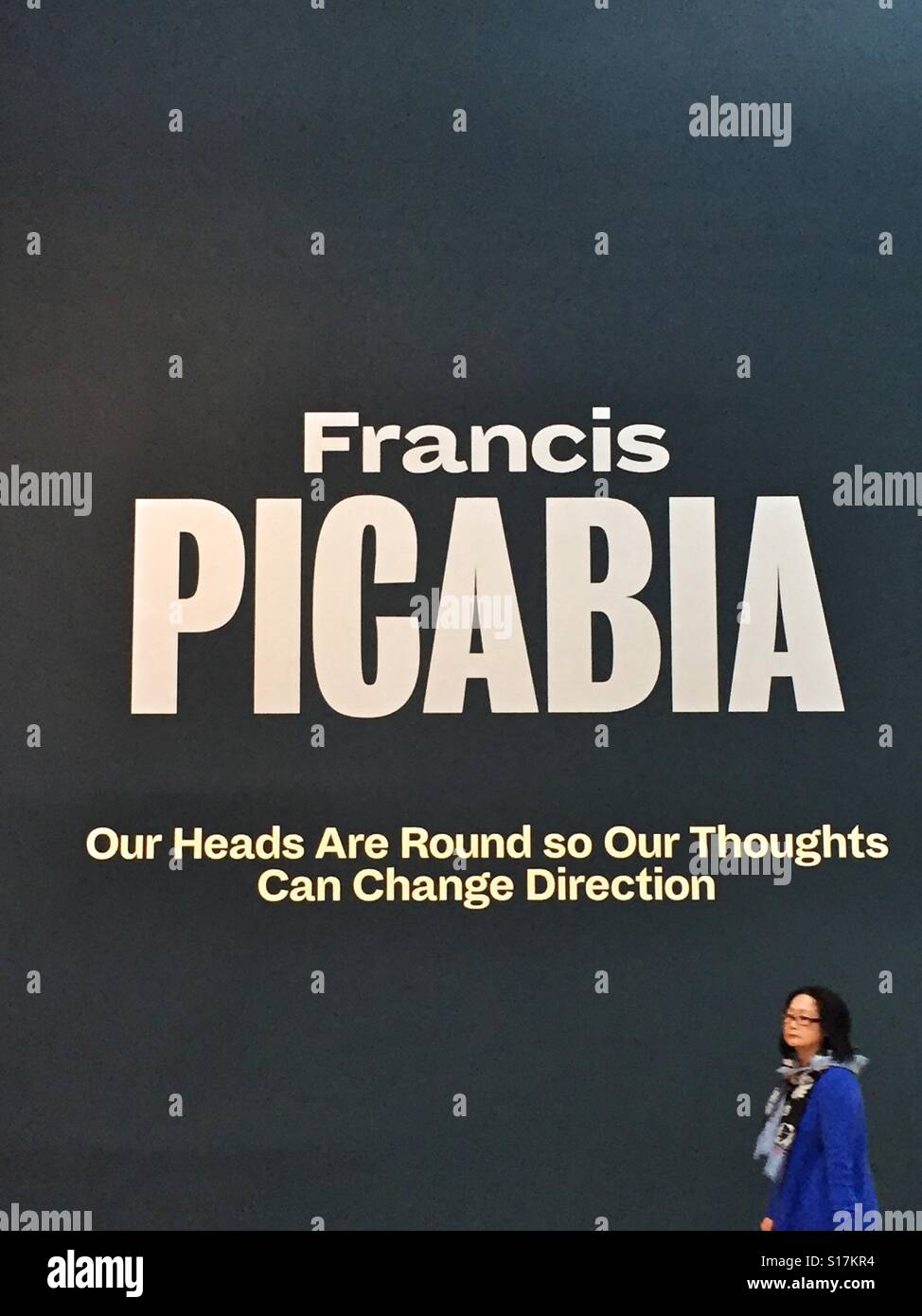 Francis Picabia MOMA exhibition, New York, entrance to gallery with quote 'Our Heads are round so our thoughts can change direction' - Smartphone Captured Stock Image
