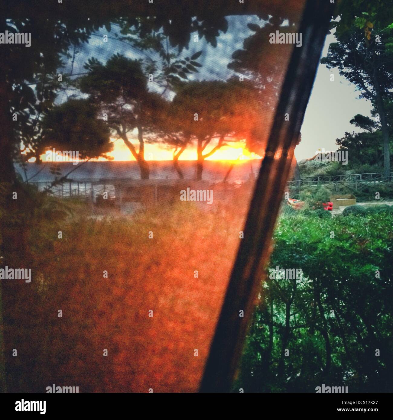 Pulling back the curtains at sunrise - Smartphone Captured Stock Image