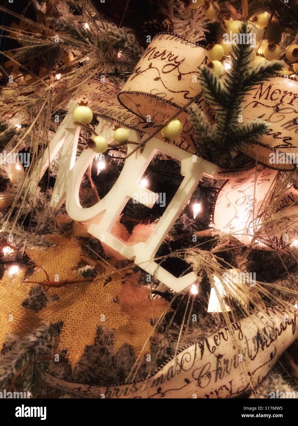 Closeup of Christmas tree ribbon, lights and ornaments. - Smartphone Captured Stock Image