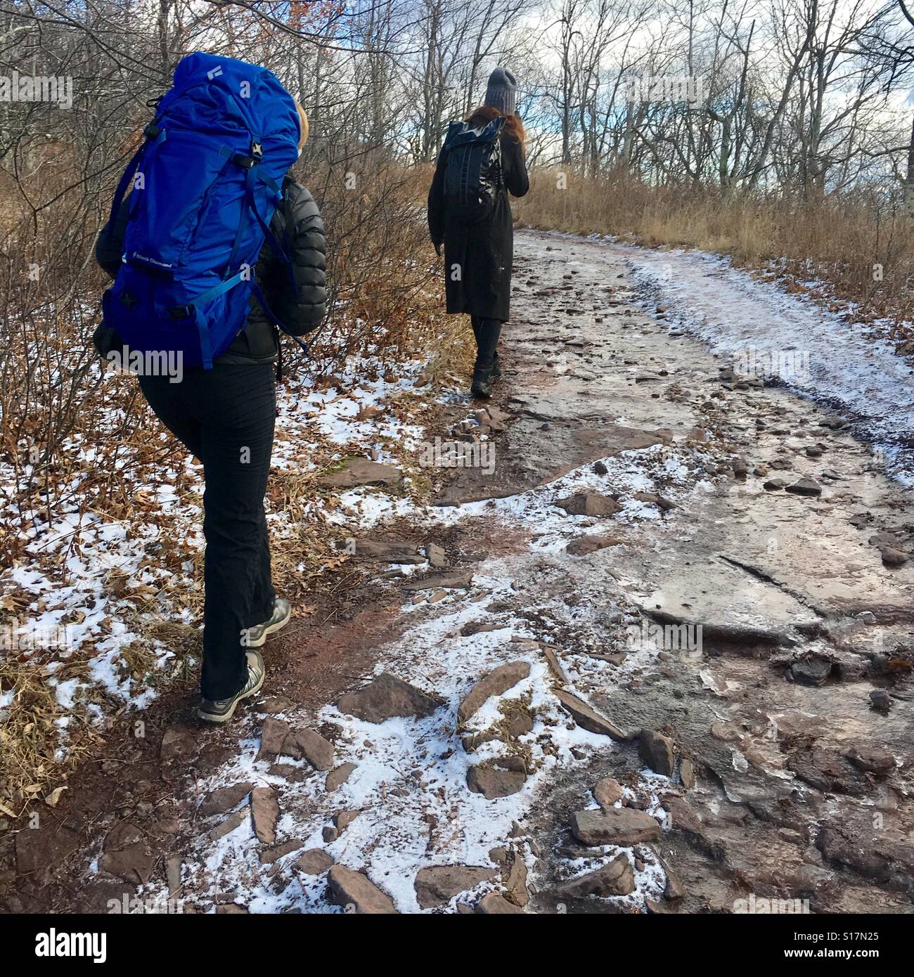 2 people hiking in cold weather Stock Photo