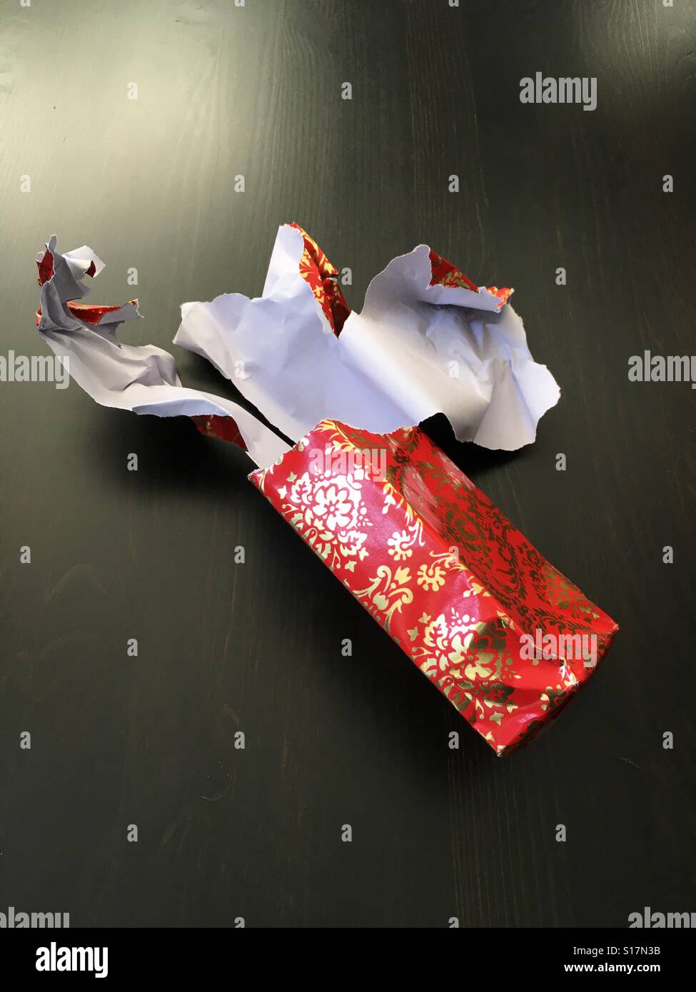 Roped open Christmas gift paper Stock Photo