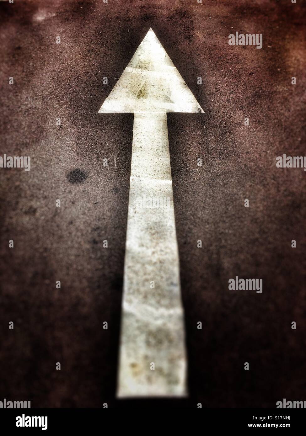 Arrow on the road. - Smartphone Captured Stock Image
