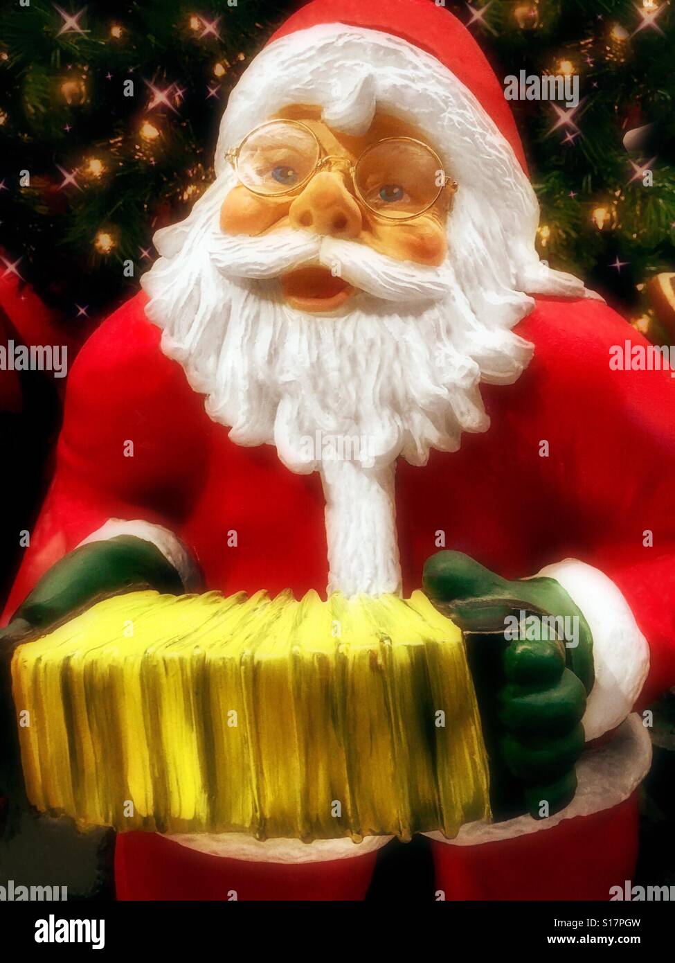 Santa playing a squeezebox Stock Photo