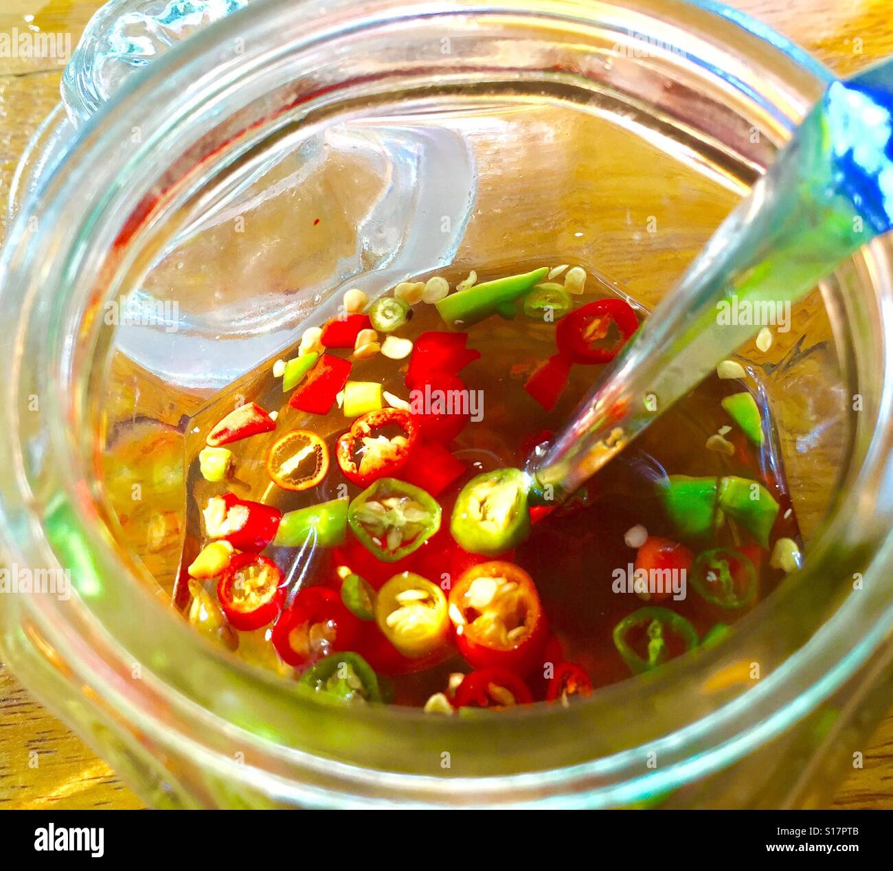 Thai condiments sliced chili mixed with fish sauce (Nam pla Stock