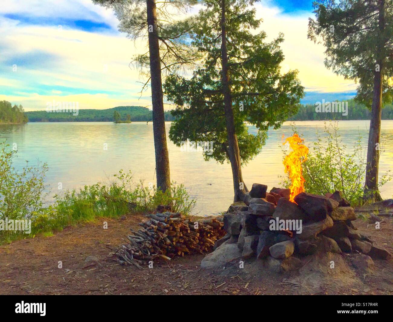 Campfire Flames Rising At Island Lake Stock Photo - Alamy