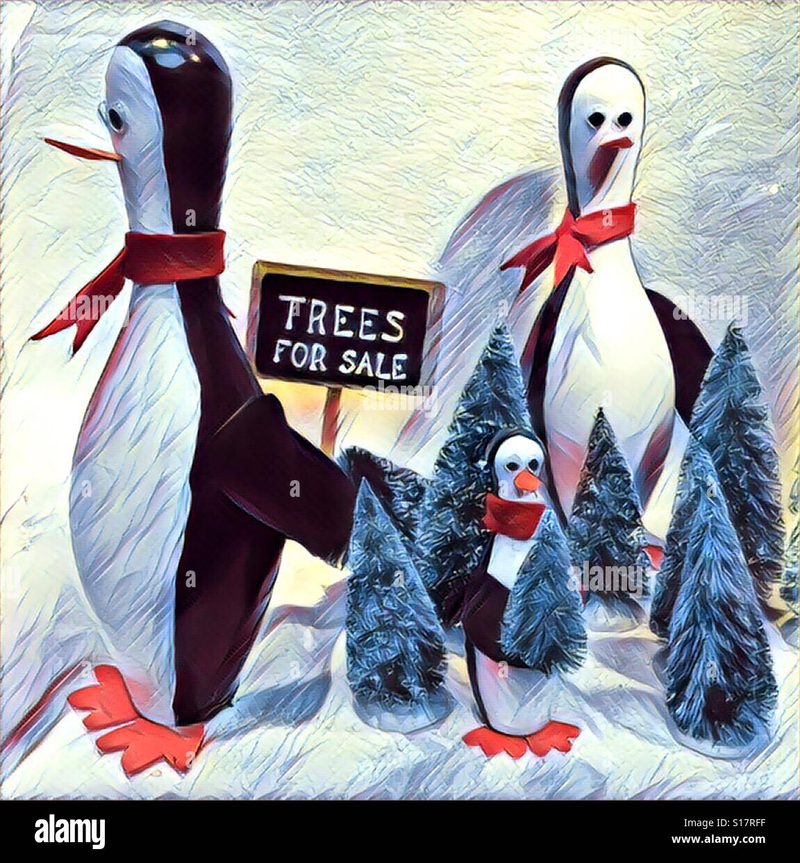 A mother, father and baby penguin that look like bowling pins bear a 'trees for sale' sign and standing among Christmas trees - Smartphone Captured Stock Image