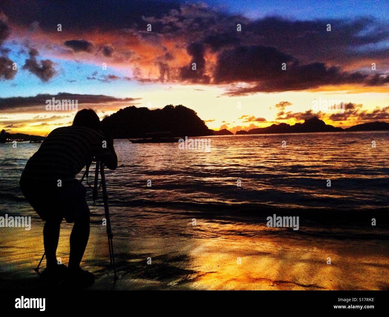 Photographer in action. Sunset at El, Nido, Palawan Stock Photo