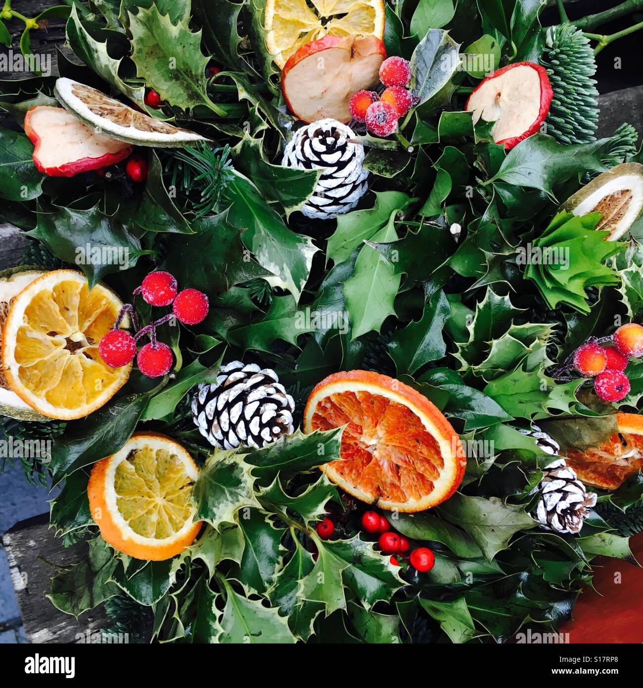 Christmas wreath decoration with pine cones and dried fruit UK Stock Photo