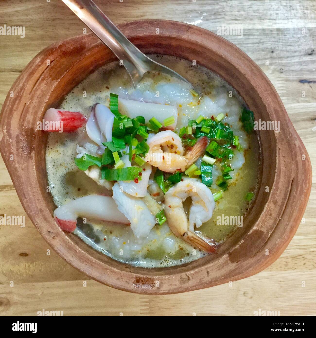Seafood porridge served in a clay pot, Bangkok Stock Photo Alamy