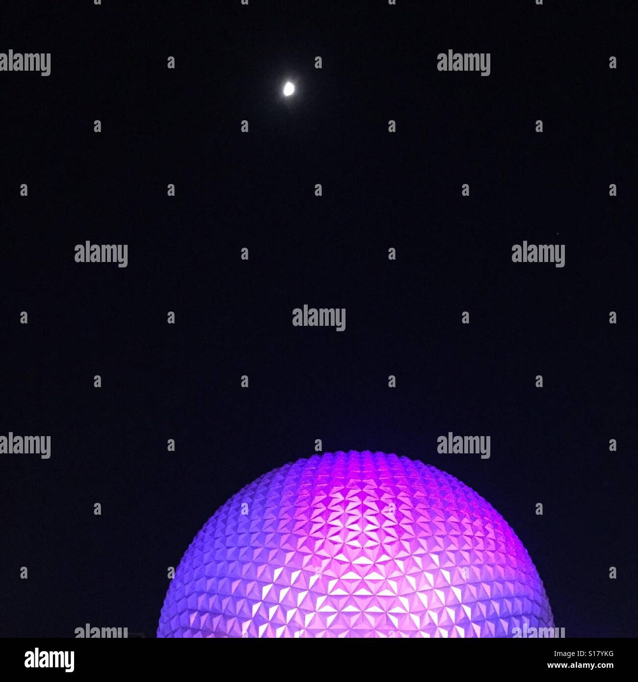 Moon over spaceship Earth at Walt Disney World's Epcot Center Stock Photo