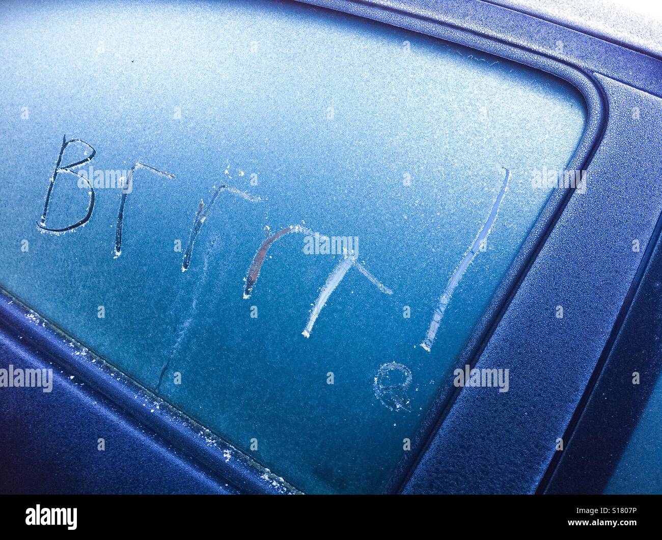 Frosty written message in car window - Smartphone Captured Stock Image