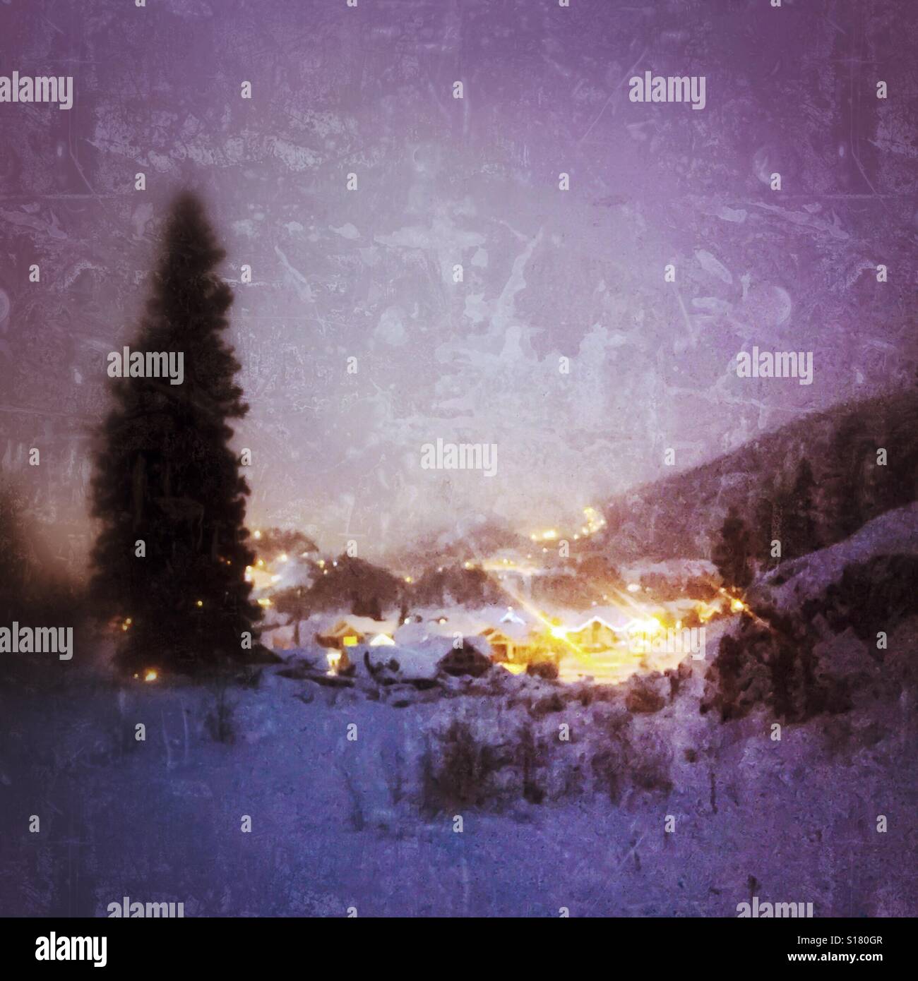 Winter landscape of a small community glowing on a snowy winter night. Distressed edit, square crop. - Smartphone Captured Stock Image