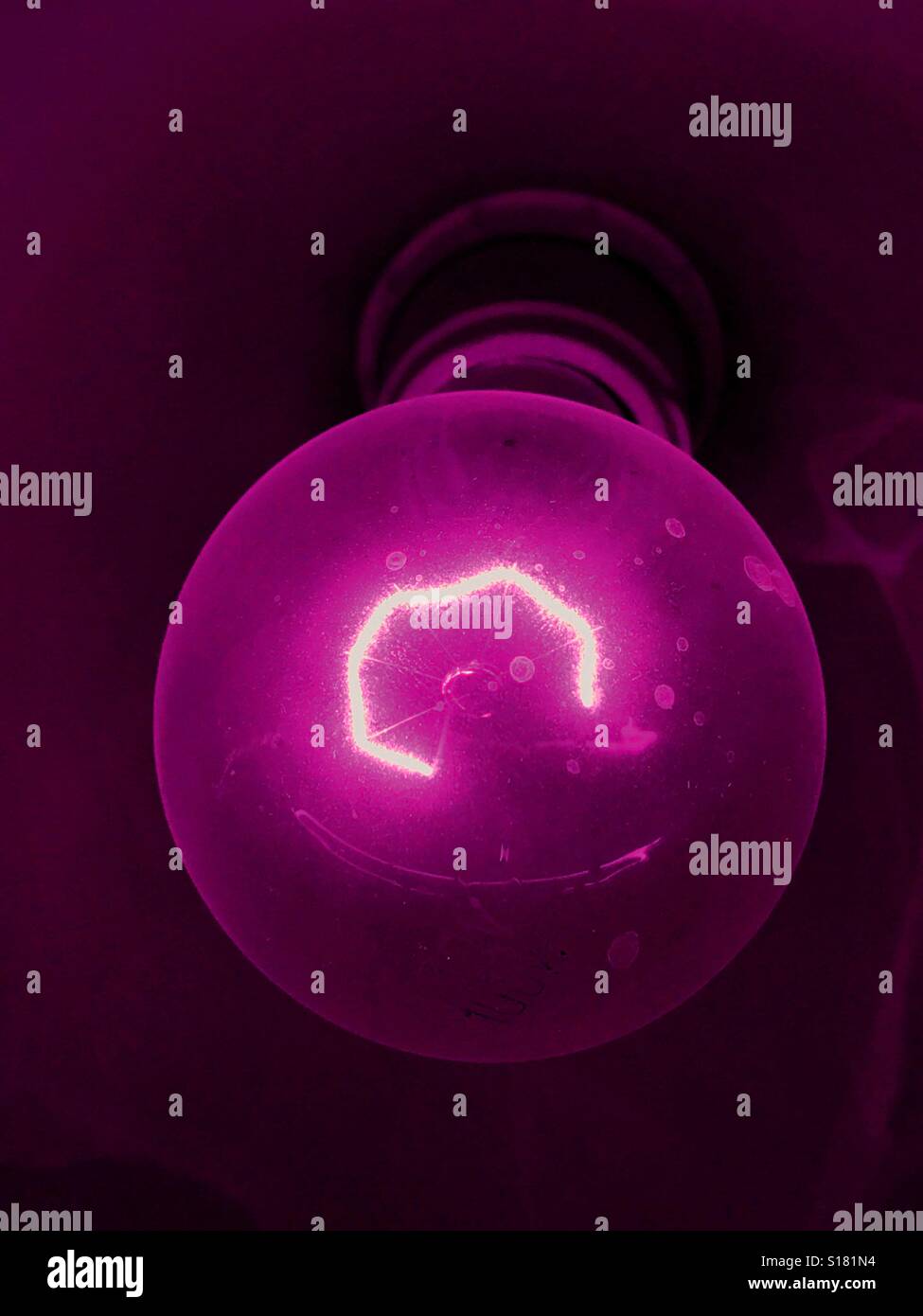 Bulb with filament in violet - Smartphone Captured Stock Image