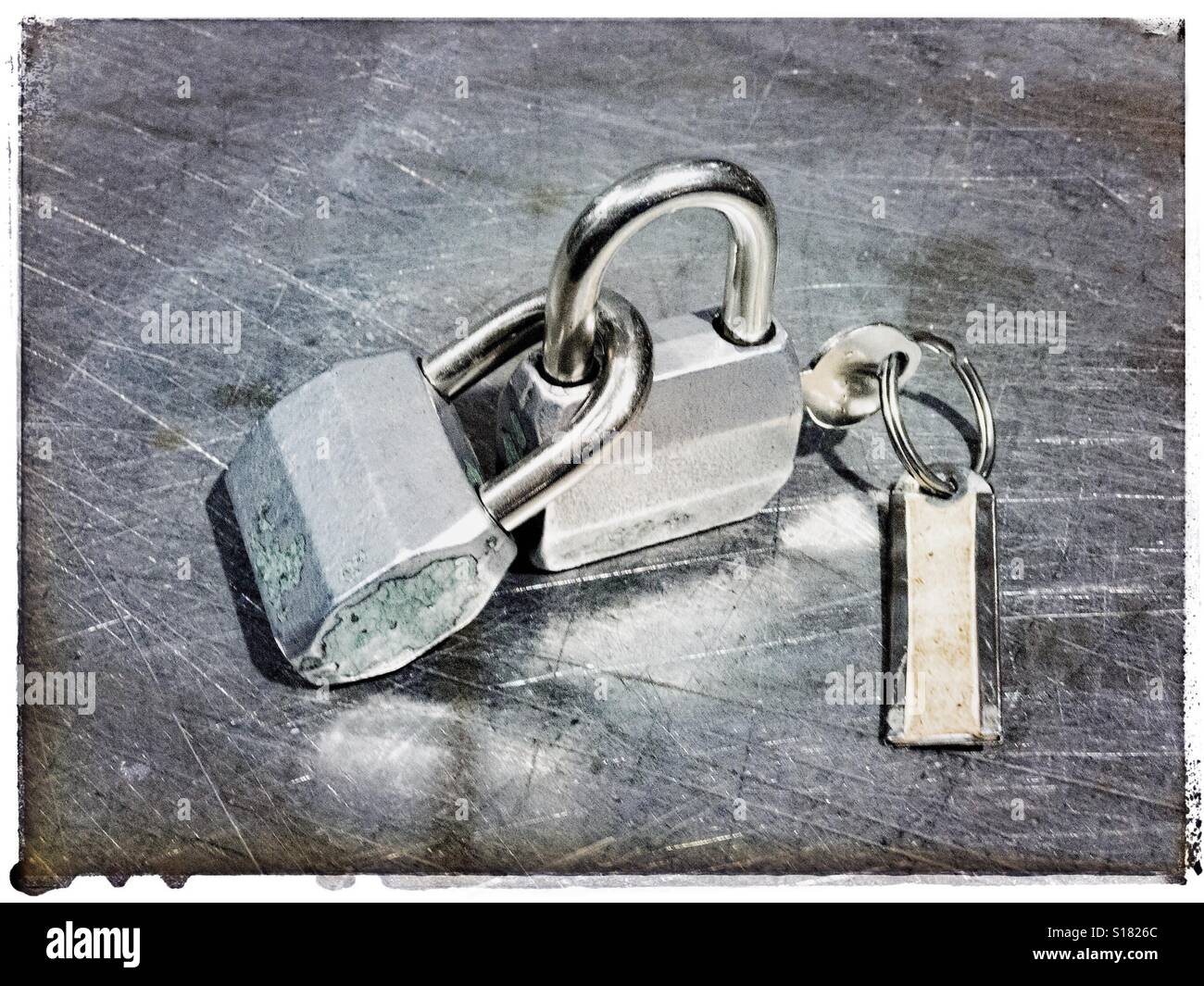 Two padlocks joined together - Smartphone Captured Stock Image