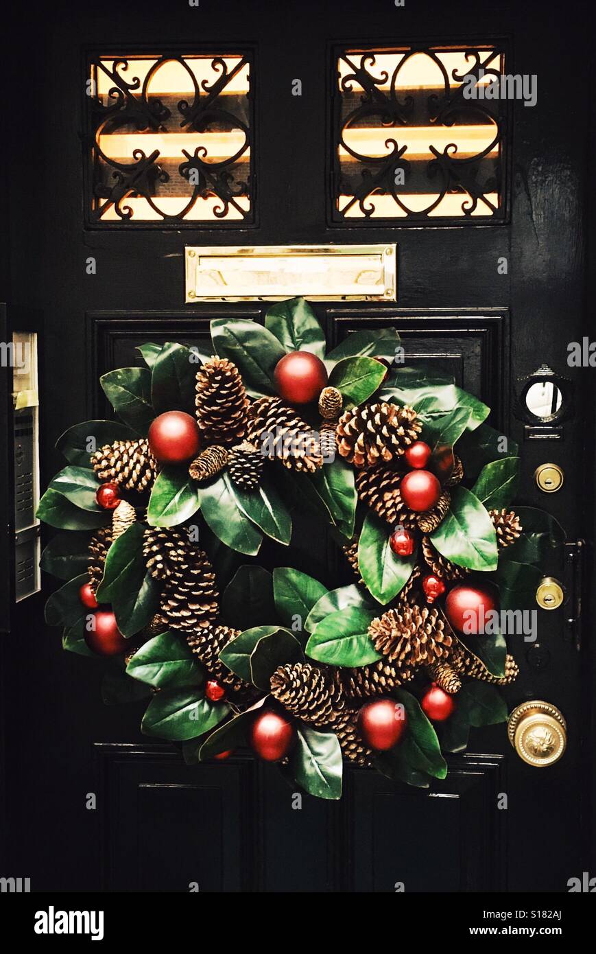 Christmas wreath on city door. - Smartphone Captured Stock Image