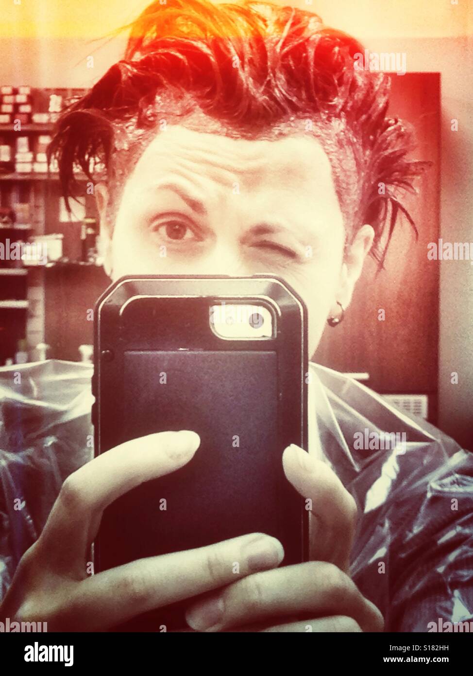 Selfie during dyeing hair at a beauty salon - Smartphone Captured Stock Image