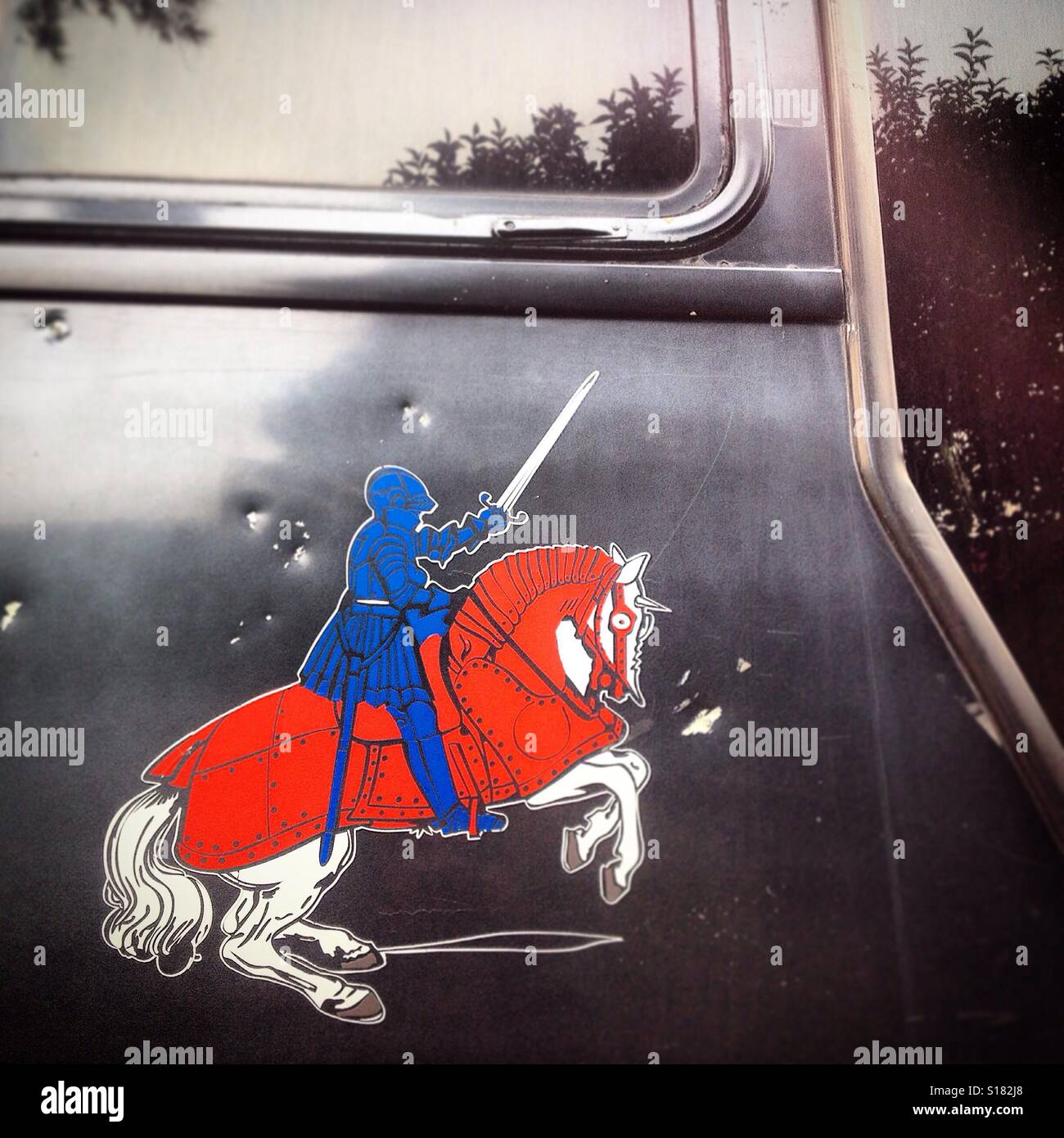 A sticker of a knight riding a white horse decorates a bus in Mexico City, Mexico Stock Photo
