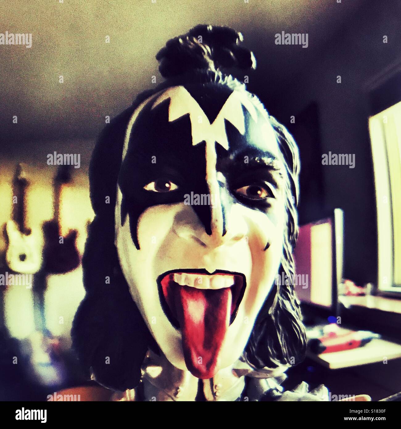 Replica of Gene Simmons from KISS with tongue sticking out Stock Photo