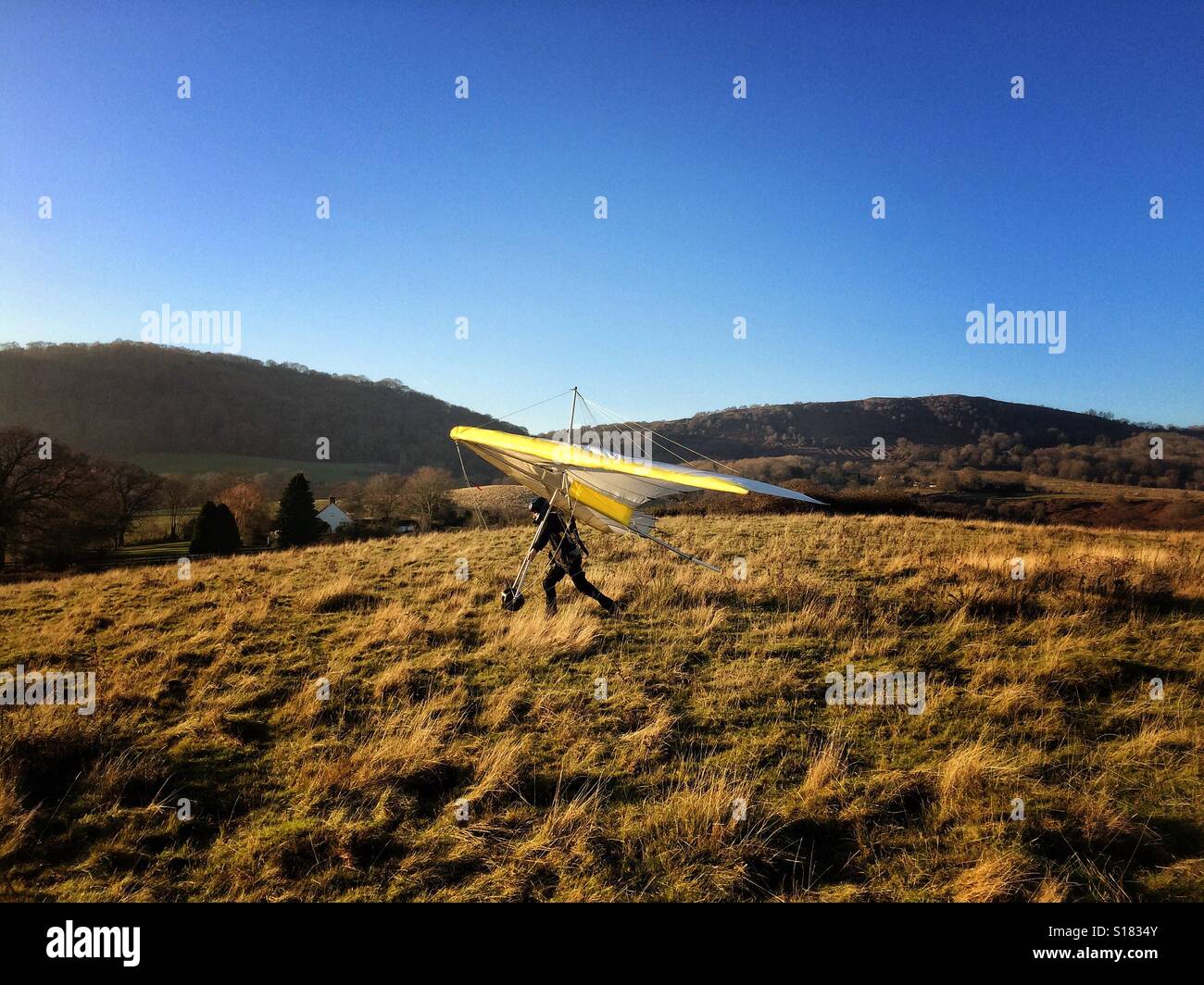 Man launching a hang glider Stock Photo