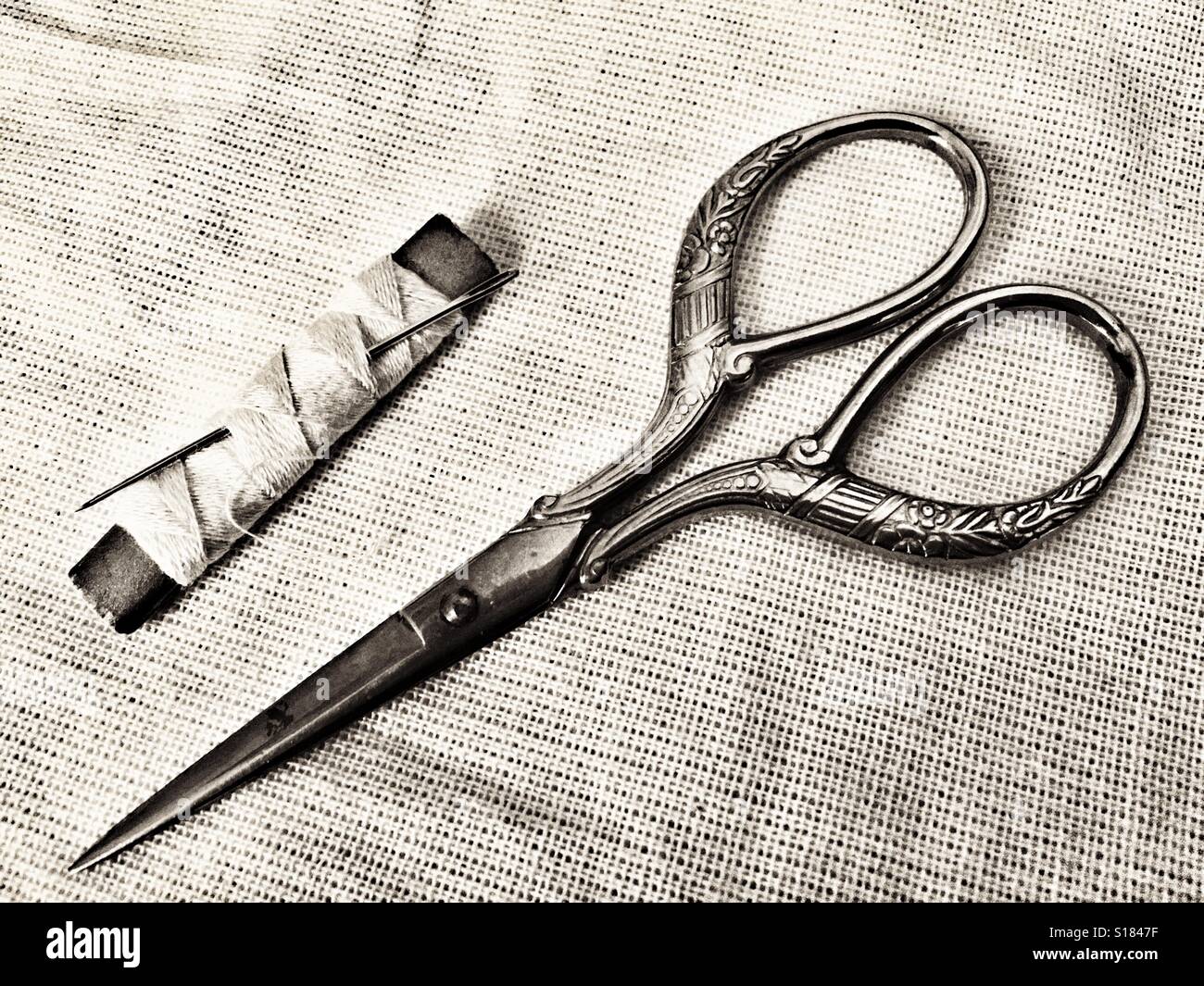 Vintage scissors, needle and thread - Smartphone Captured Stock Image