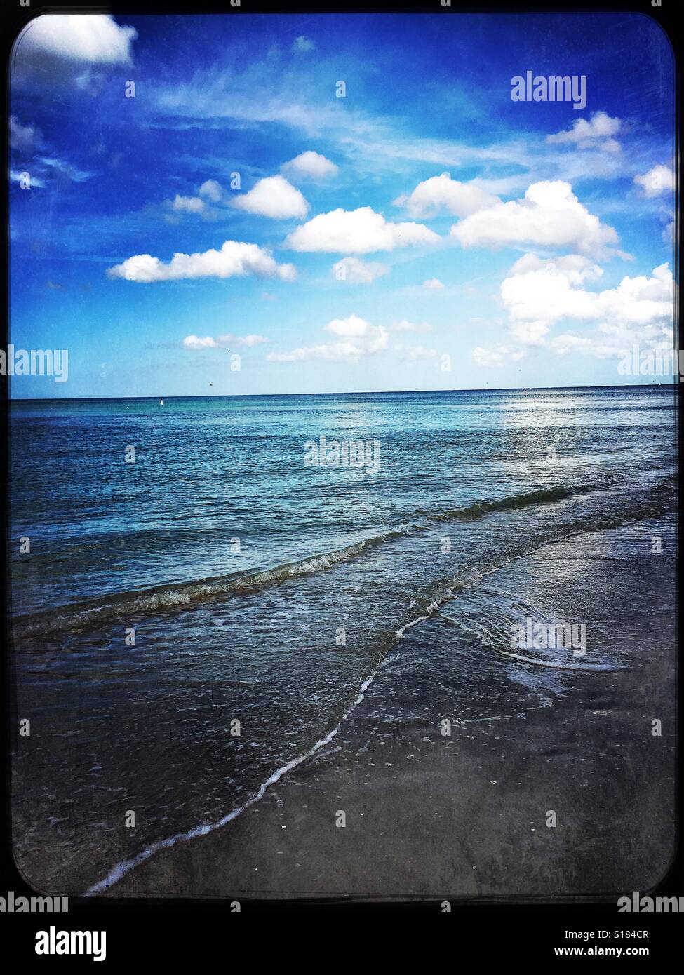 Waves washing up on beach - Smartphone Captured Stock Image