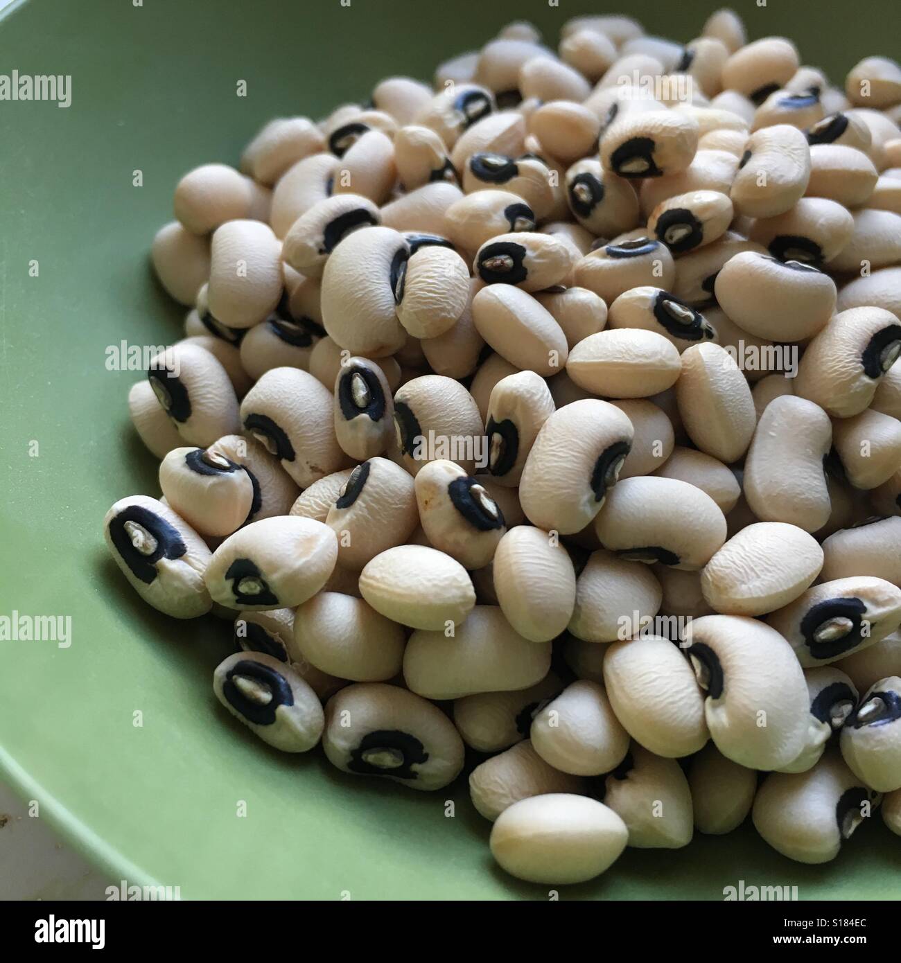 Dry black eyed pea in bowl Stock Photo