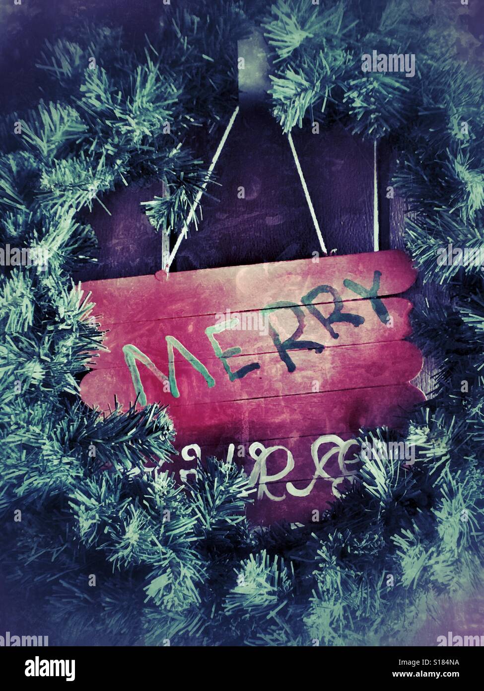 Christmas wreath hanging on a door - Smartphone Captured Stock Image